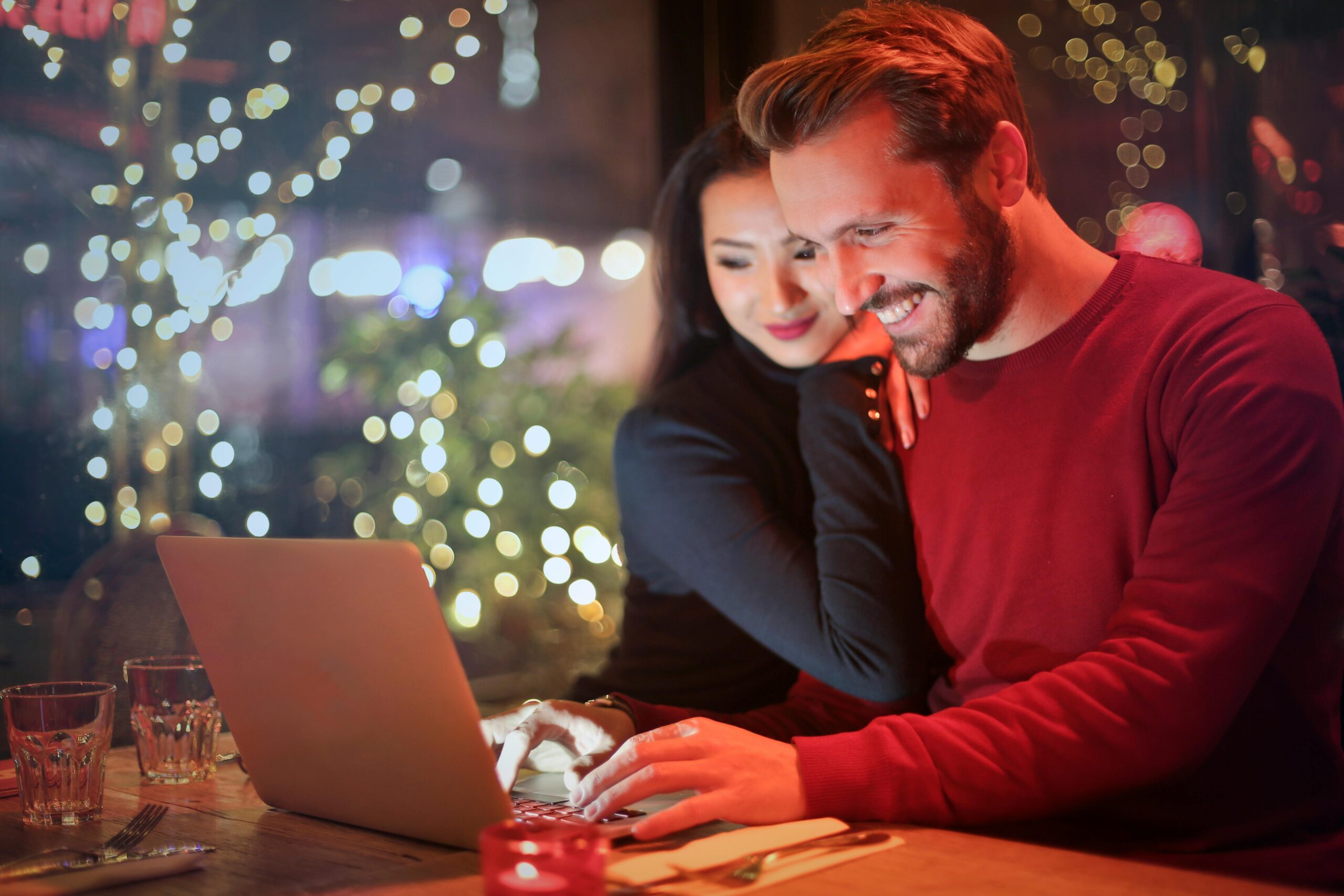 couple smiling and researching the best Bethesda, Maryland, dentists